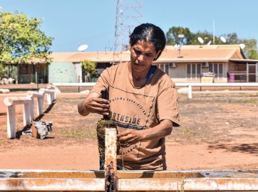 Anindilyakwa artist Vera Lalara making bush-dyed textiles, 2022