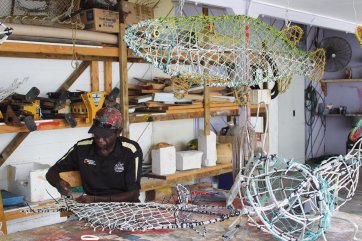 Kim Norman working underneath a sculpture of a Saratoga for NYC UN show , 2017