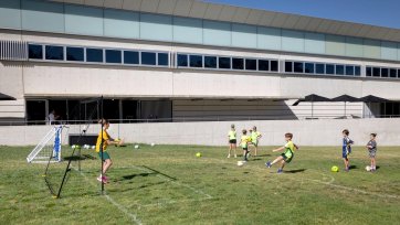 Children playing soccer outside the National Portrait Gallery