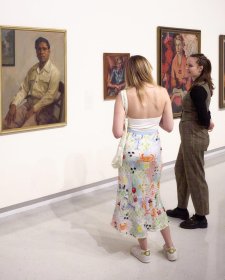 Visitors looking at Harold Blair, 1948 by Ernest Buckmaster. Purchased 2010 © Estate of Ernest Buckmaster